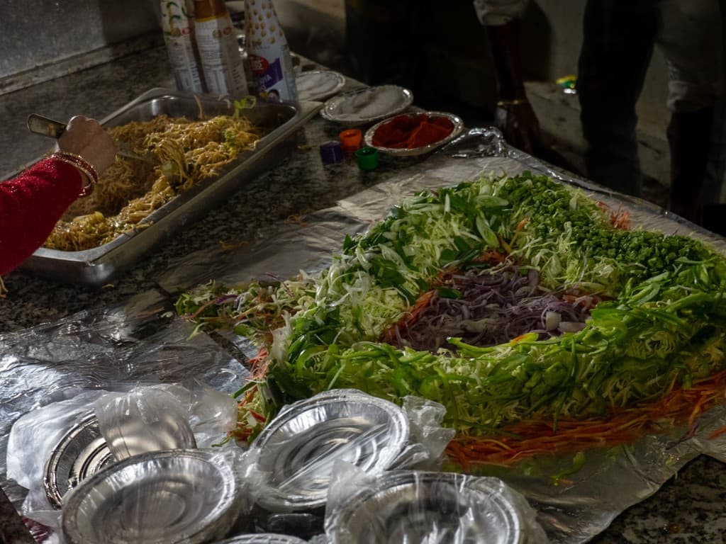Fresh salad and live counter display at catering event
