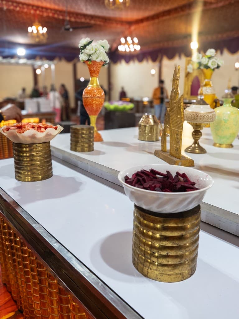 Elegant buffet decor with brass ornaments at Dehradun catering event