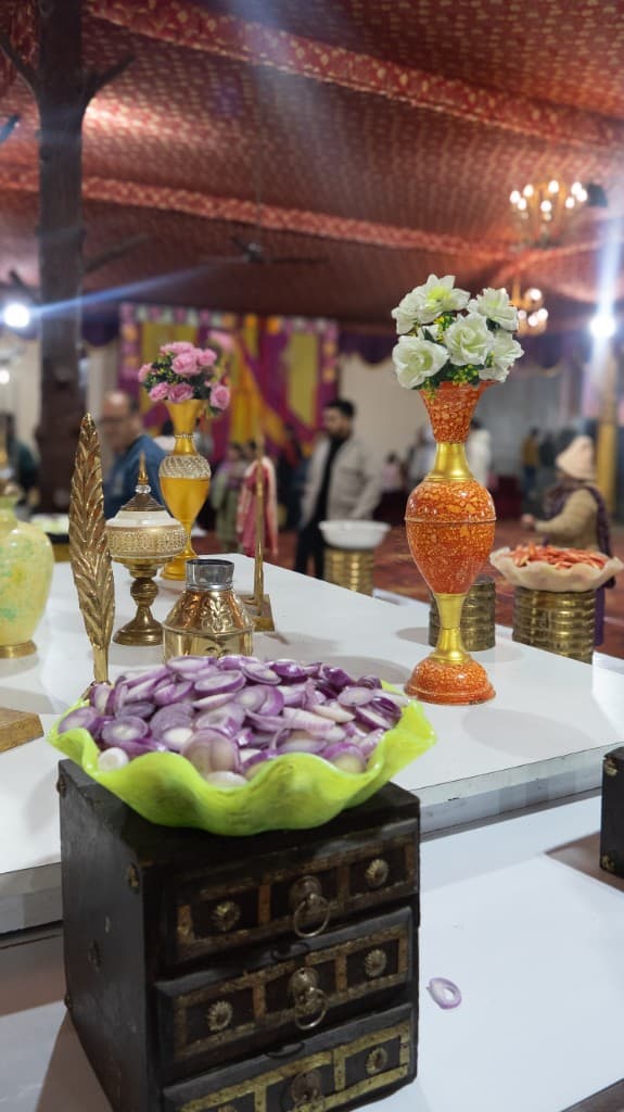 Colorful buffet table decoration with flowers and brass items